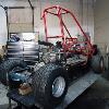 Current build. 1981 Honda Odyssey FL250. Mods: Cut off rear frame section, added boxed swingarm, 600cc Katana engine, Banshee rearend, Street tires for dragstrip running, and we have much more to do.